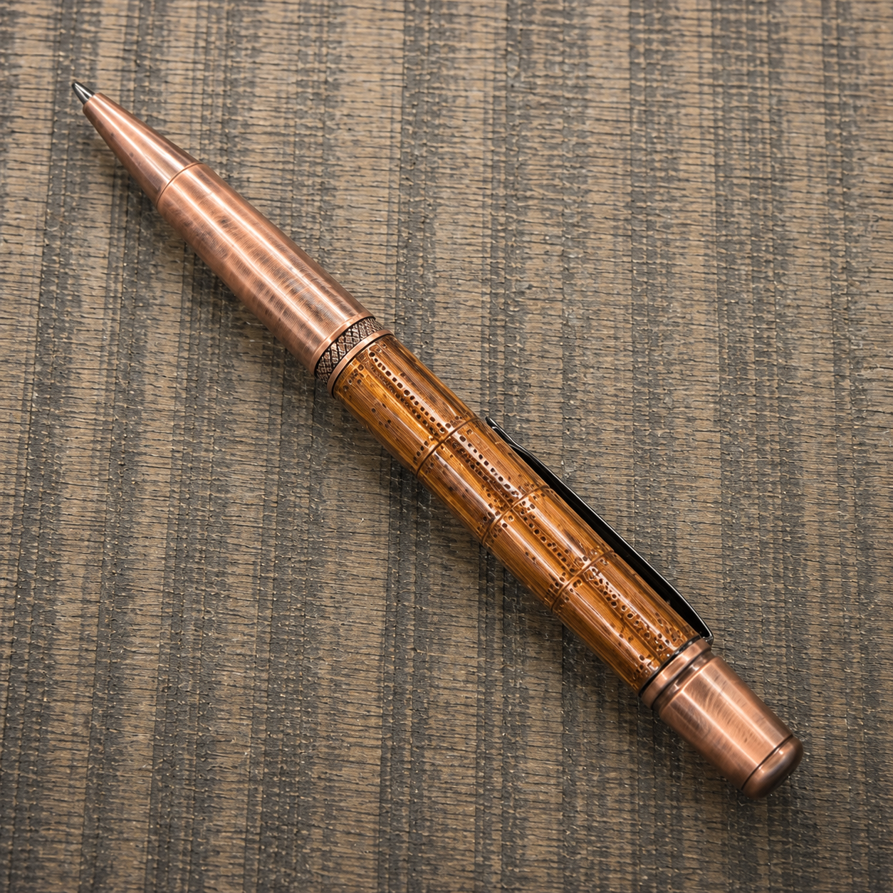 Handcrafted steampunk copper ballpoint pen featuring exposed mechanical details and antique copper hardware.